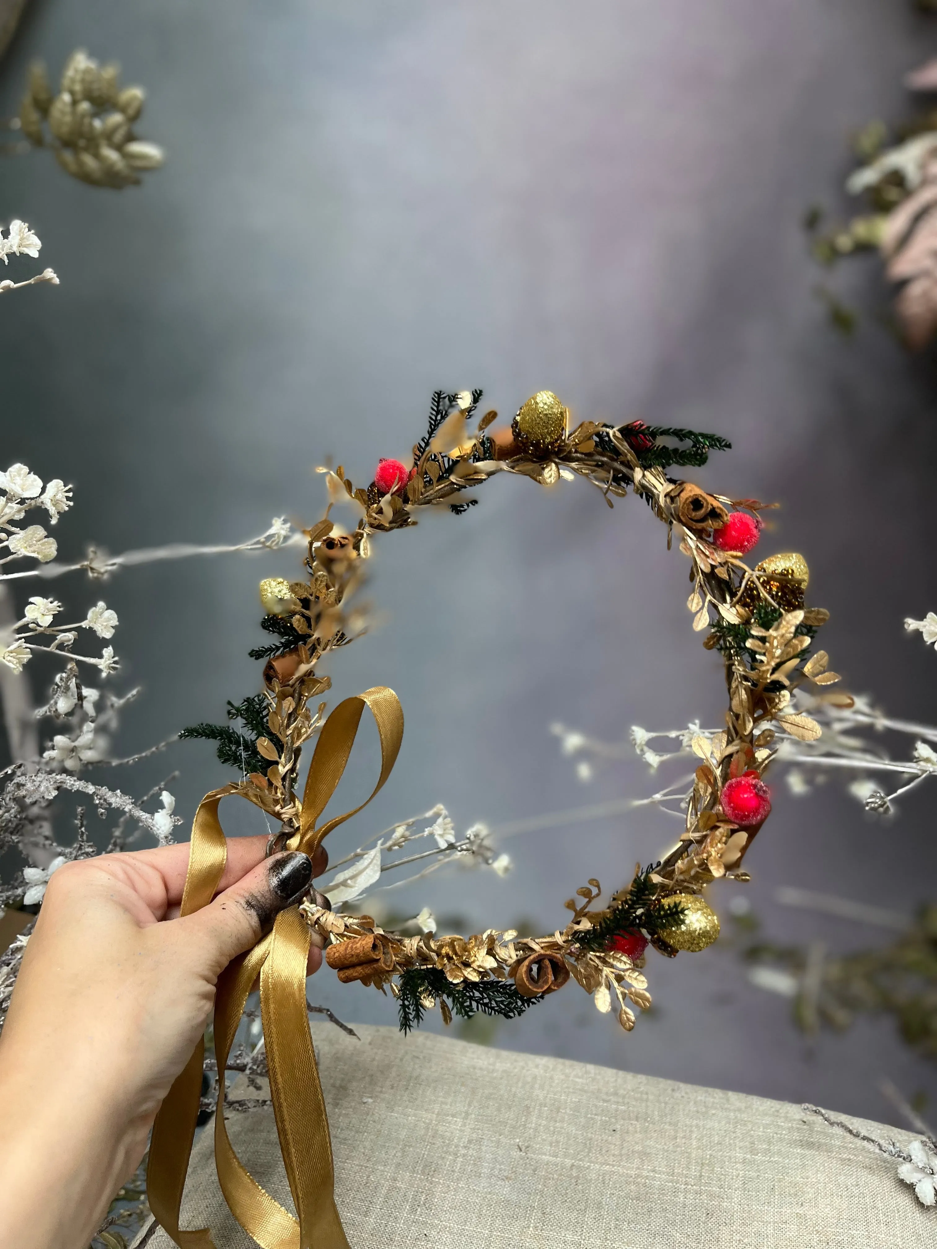 Golden Christmas flower wreath with cinnamon