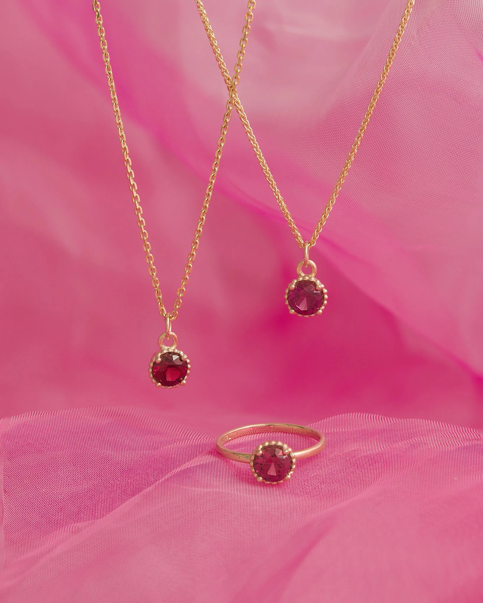 Round Galatée Ring in 14k Yellow Gold with raspberry-toned Tanzanian Moyo Garnet